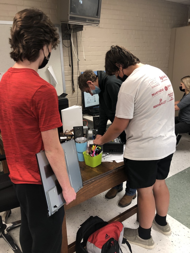 Students repair a computer